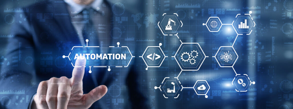 A man in a business suit presses the word automation on a screen. The word automation is surrounded by various graphics illustrating automated processes.