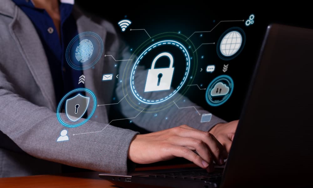 FTC Safeguards Rule concept photo: I.T. professional implementing data protection measures for cybersecurity compliance