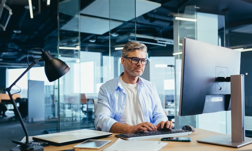 Proactive I.T. management: software engineer patching up software.