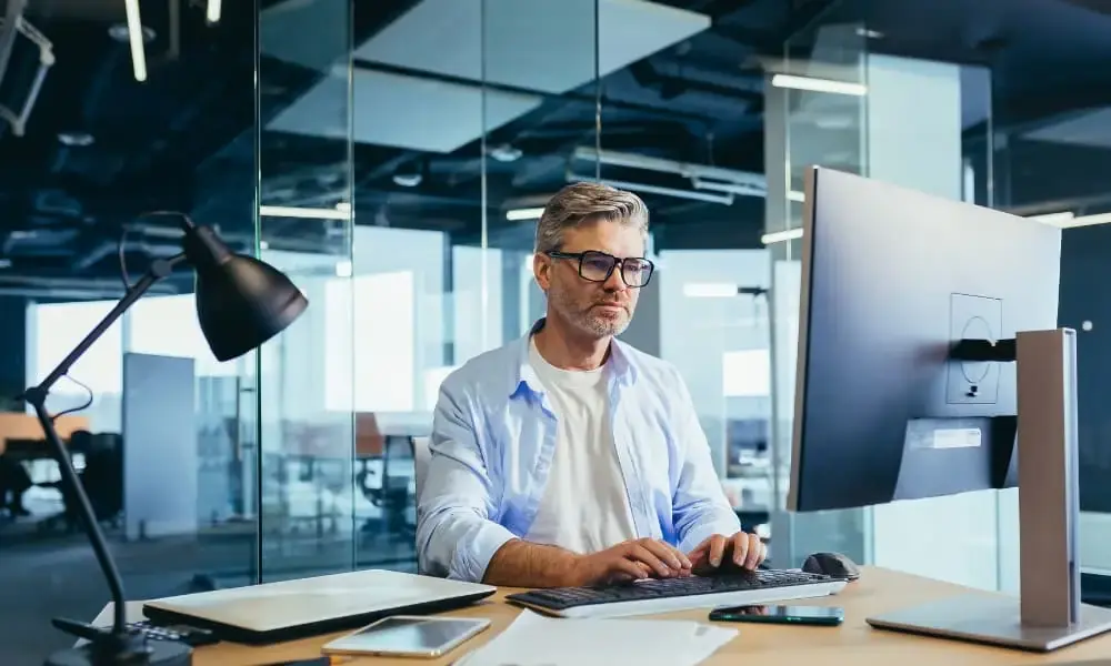 Proactive I.T. management: software engineer patching up software.