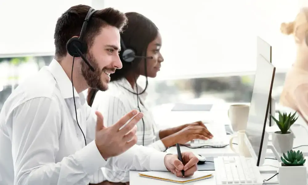 Employees using business VoIP solutions.