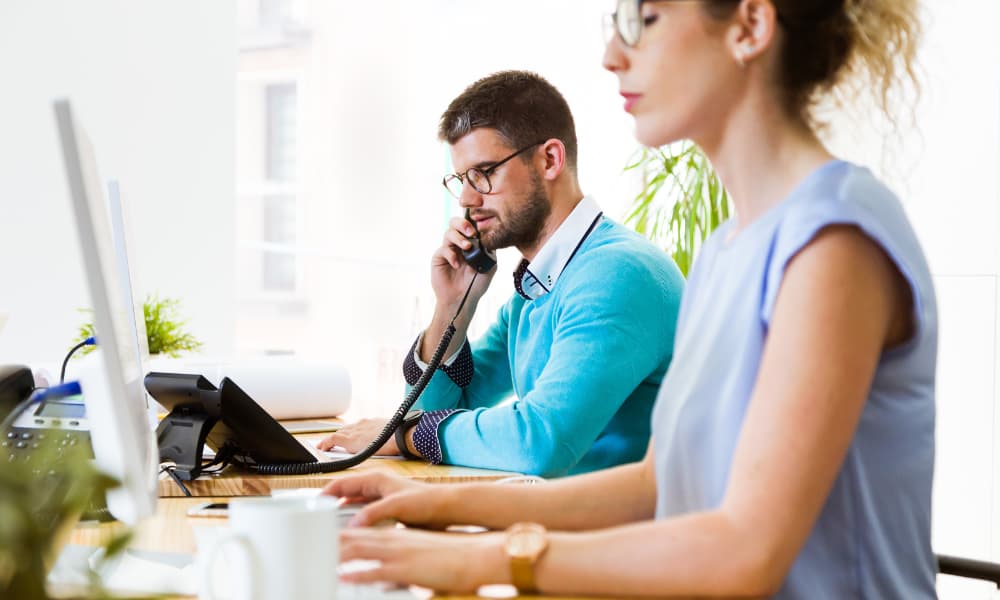 SMB employees using their VoIP system.