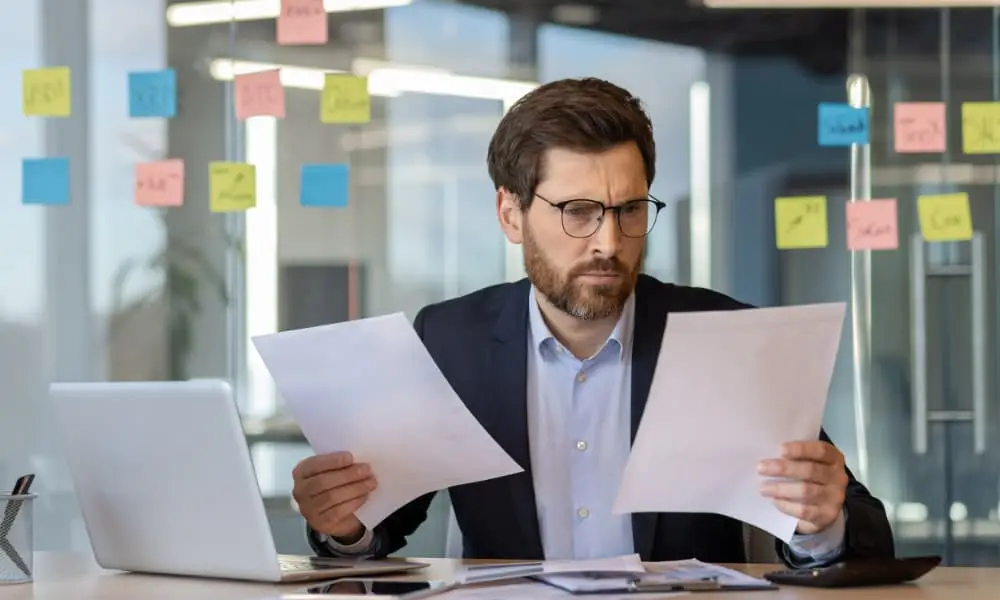 SMB owner evaluating two I.T. consulting Seattle firms on paper.