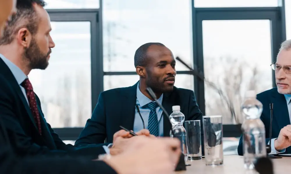 SMB leadership team discussing whether to switch managed service providers near them.