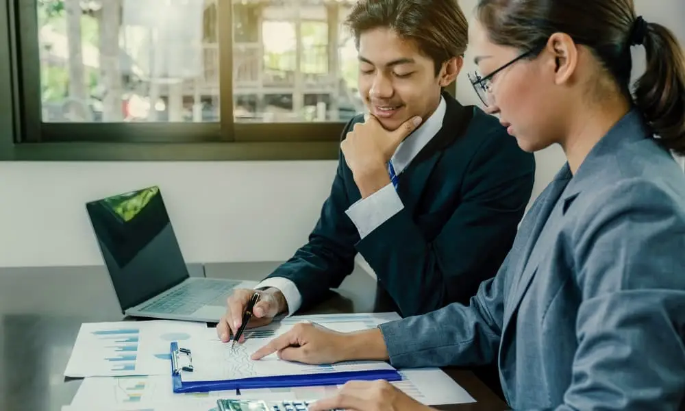 Accountants discussing how to navigate cybersecurity threats for small businesses during tax season.