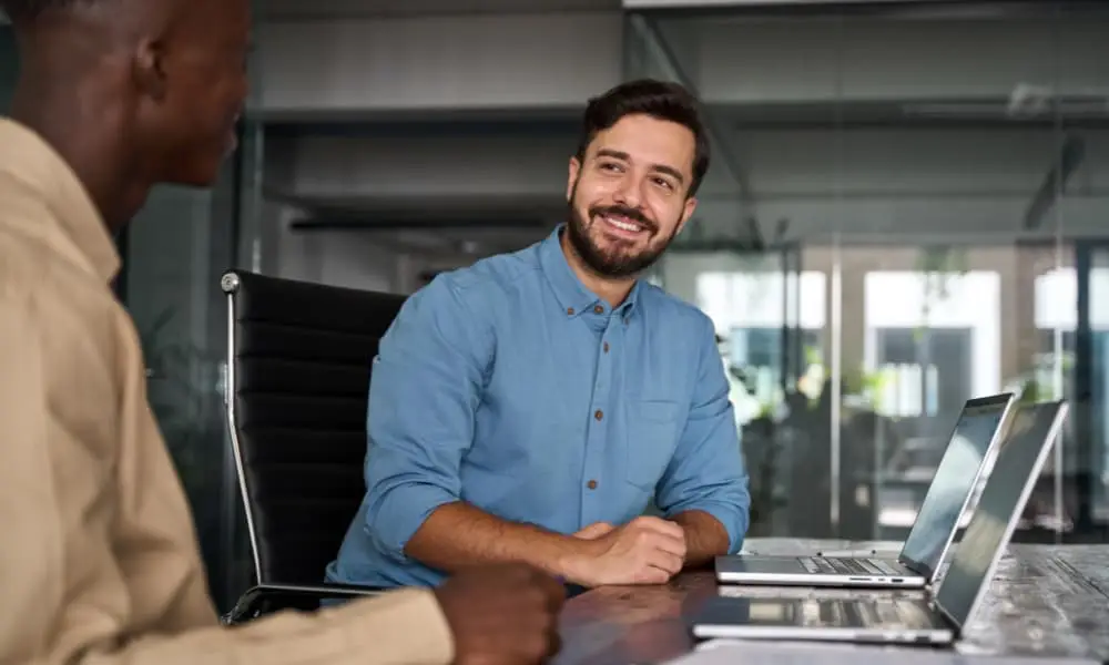 Seattle business owner discusses I.T. operations outsourcing with an MSP representative.