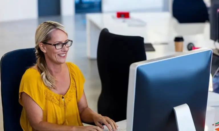 IT professional managing AI security issues on a computer.