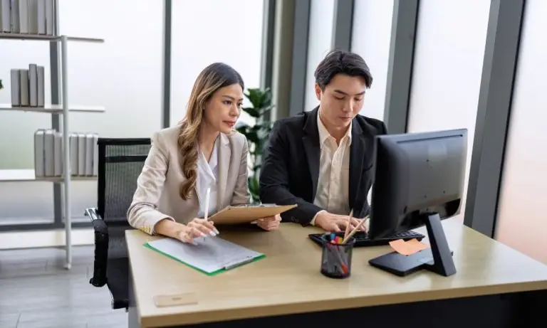 Two CPAs researching cybersecurity for accounting firms.