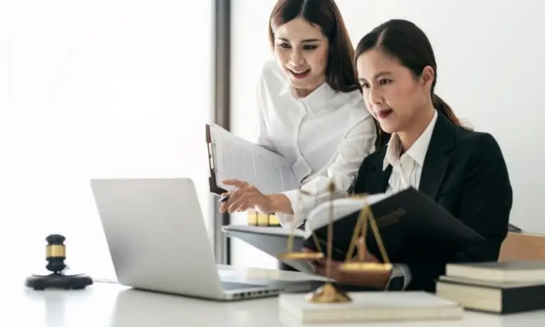 Two people discussing cybersecurity for lawyers and managed I.T. services for law firms.
