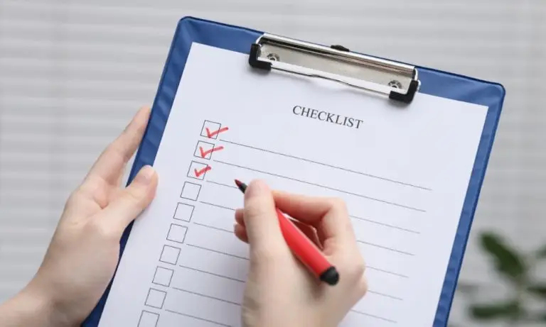 A defense contractor reviewing their ticking NIST 800-171 Compliance Checklist.